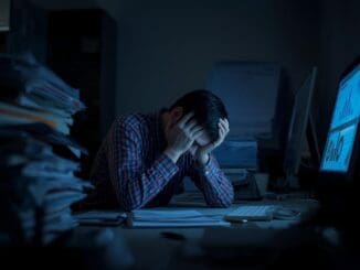 work burnout and stress person in Chicago stressed out at computer